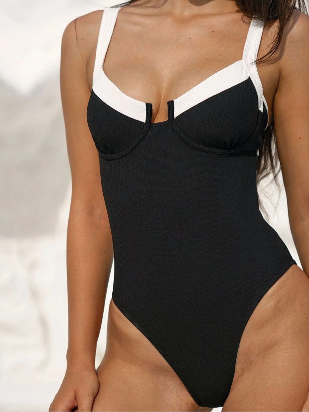 Black One-Piece Swimsuit with White Trim and Structured Cups